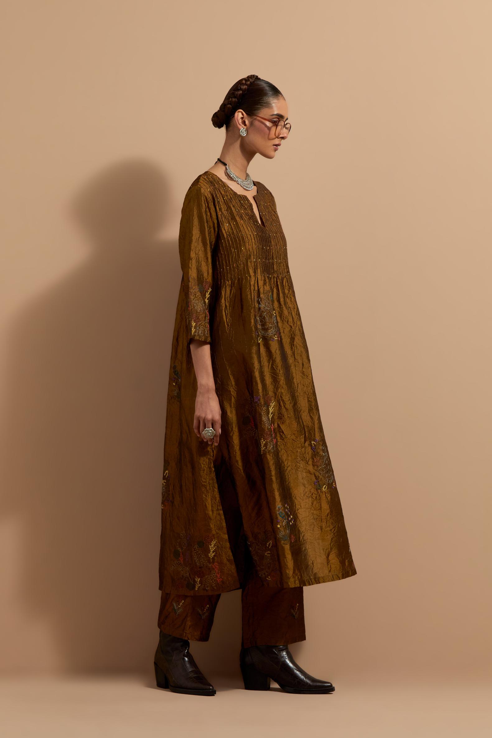 Olive crushed silk hand block printed kurta set with pin tucks at yoke, highlighted with multi colored thread embroidery.