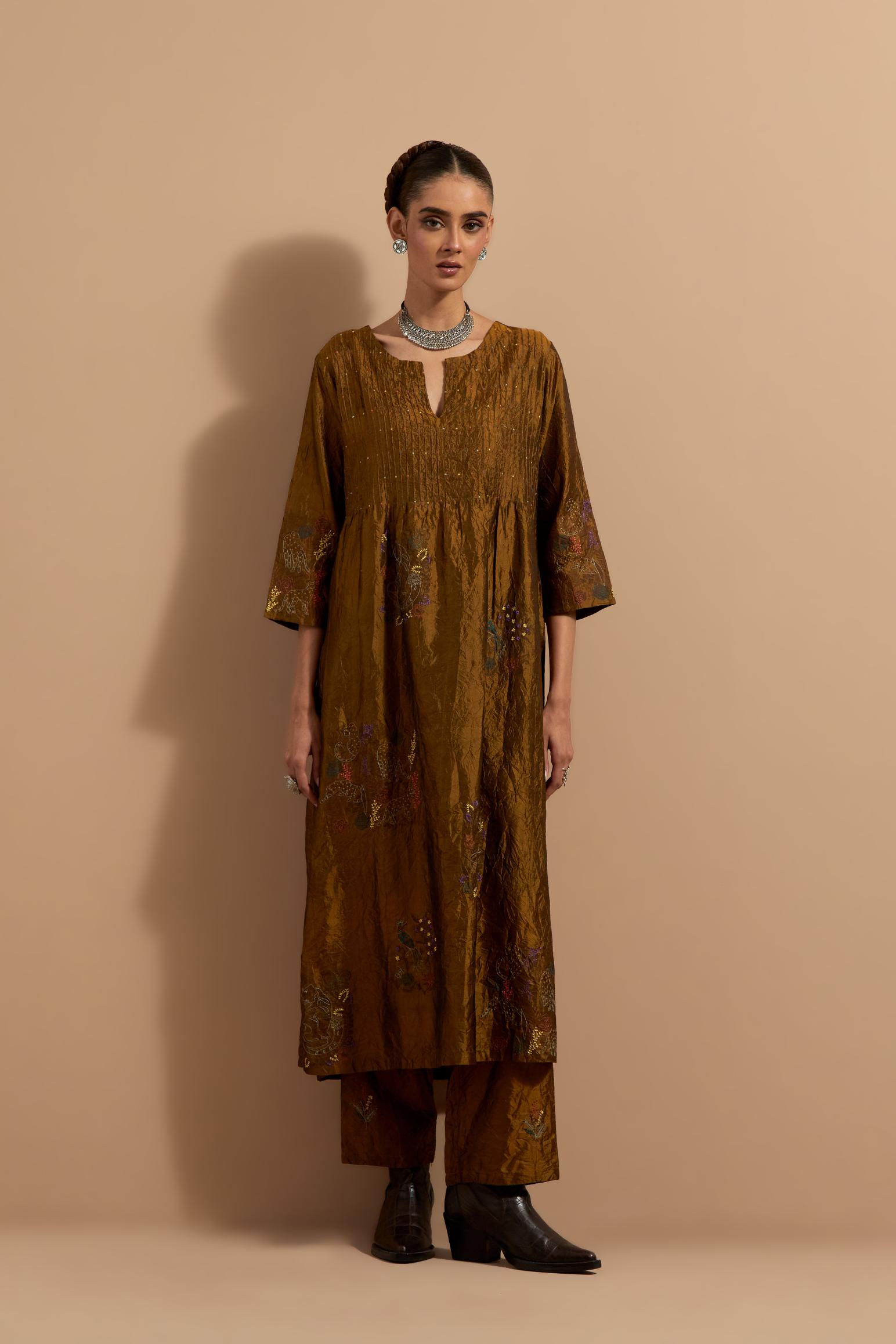 Olive crushed silk hand block printed kurta set with pin tucks at yoke, highlighted with multi colored thread embroidery.
