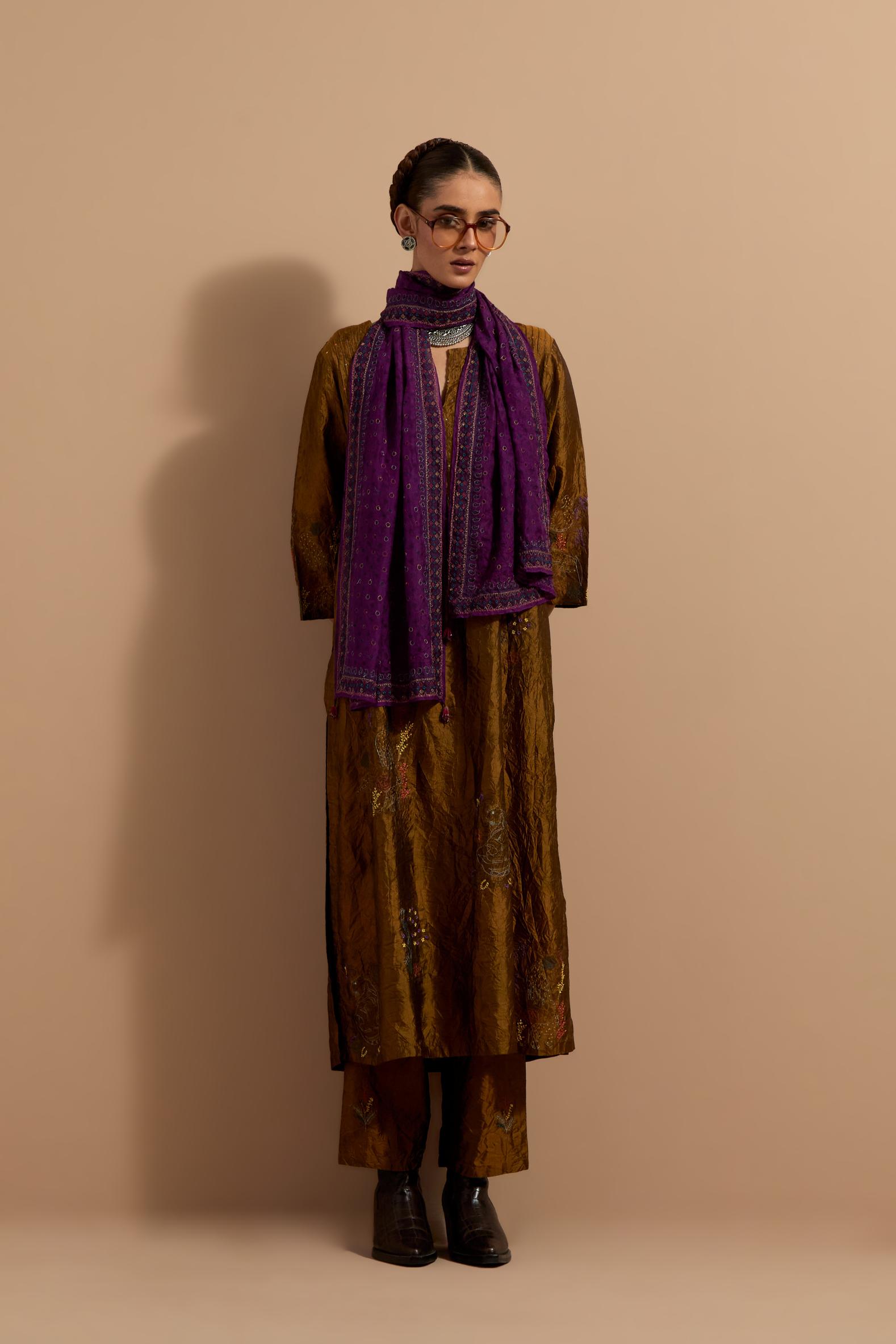 Olive crushed silk hand block printed kurta set with pin tucks at yoke, highlighted with multi colored thread embroidery.