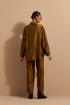 Olive crushed silk hand block printed shirt, highlighted with multi colored thread embroidery, paired with Olive crushed silk hand block printed pants, highlighted with multi colored thread embroidery.