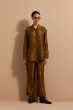 Olive crushed silk hand block printed shirt, highlighted with multi colored thread embroidery, paired with Olive crushed silk hand block printed pants, highlighted with multi colored thread embroidery.
