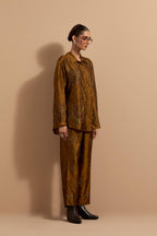 Olive crushed silk hand block printed shirt, highlighted with multi colored thread embroidery, paired with Olive crushed silk hand block printed pants, highlighted with multi colored thread embroidery.