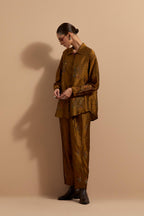 Olive crushed silk hand block printed shirt, highlighted with multi colored thread embroidery, paired with Olive crushed silk hand block printed pants, highlighted with multi colored thread embroidery.