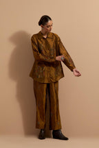 Olive crushed silk hand block printed shirt, highlighted with multi colored thread embroidery, paired with Olive crushed silk hand block printed pants, highlighted with multi colored thread embroidery.