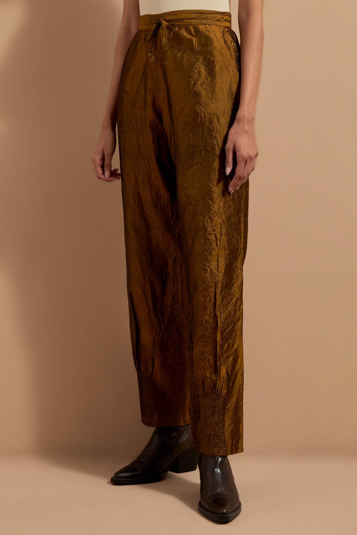 Olive crushed silk hand block printed pants with pin tucks detailing at hem.