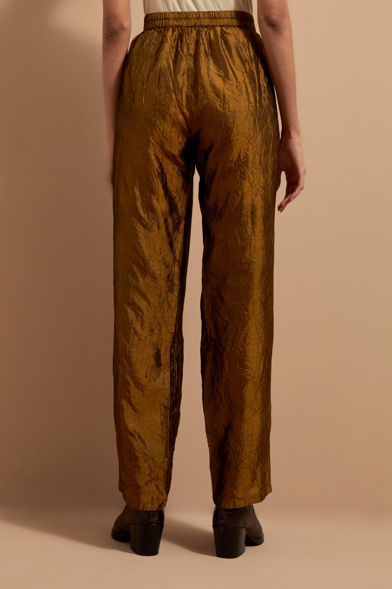 Olive crushed silk hand block printed pants with pin tucks detailing at hem.