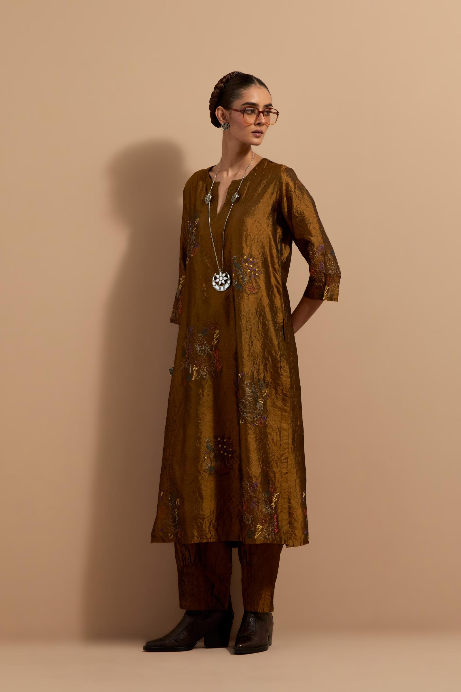 Olive crushed silk hand block printed straight kurta set, highlighted with multi colored thread embroidery.