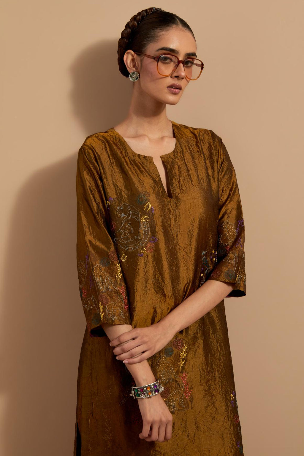 Olive crushed silk hand block printed straight kurta set, highlighted with multi colored thread embroidery.