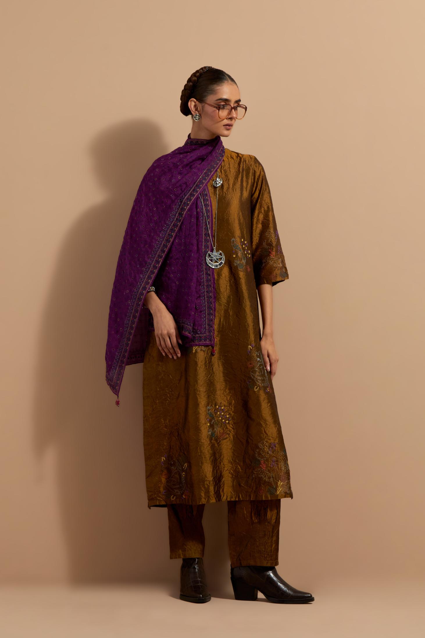 Olive crushed silk hand block printed straight kurta set, highlighted with multi colored thread embroidery.