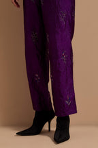 Purple crushed silk hand block printed pants, highlighted with multi colored thread embroidery.