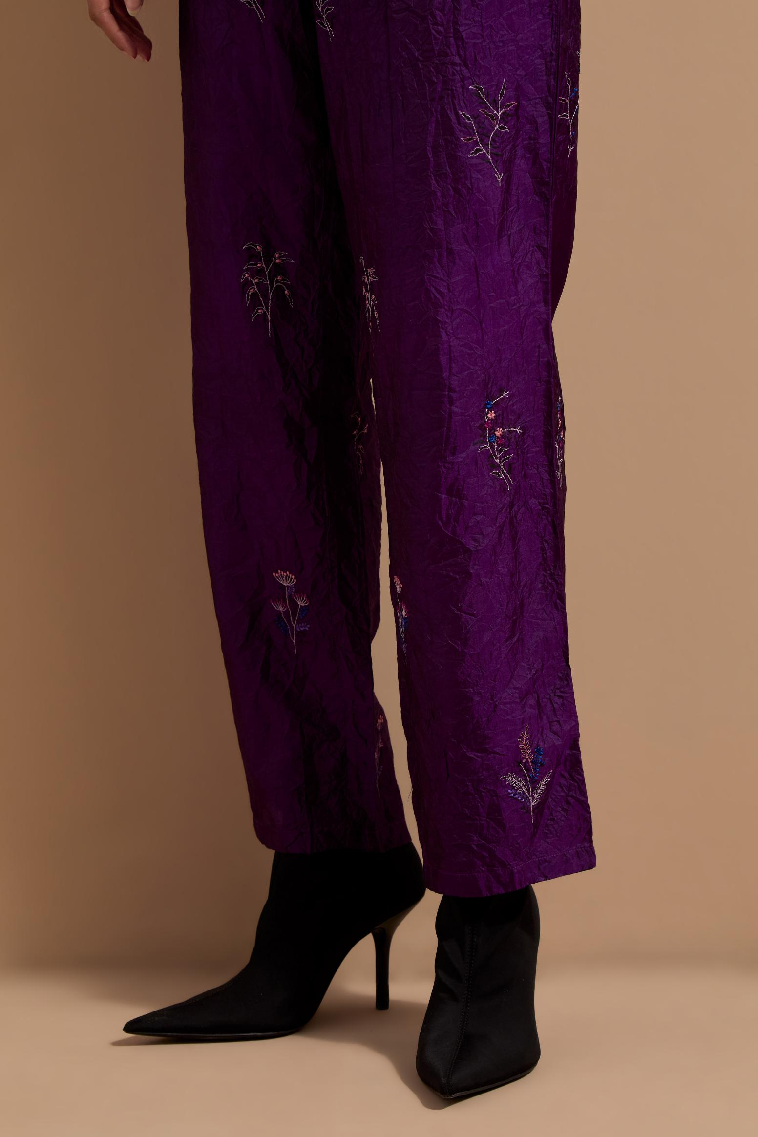 Purple crushed silk hand block printed pants, highlighted with multi colored thread embroidery.