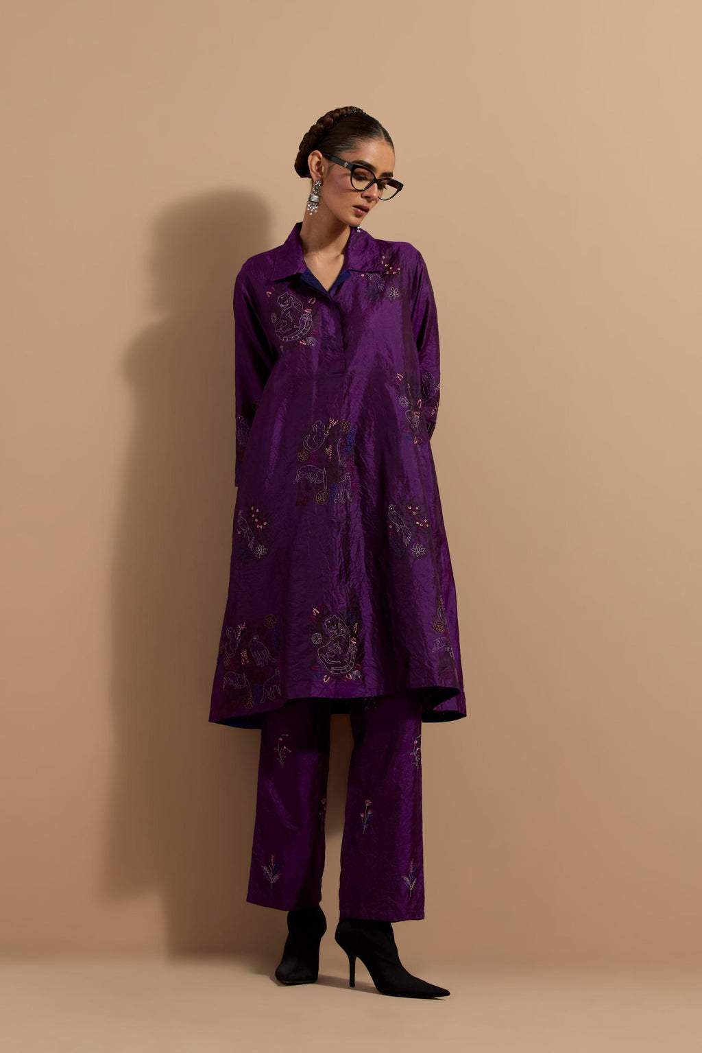 Purple crushed silk A-line short kurta set with hand block print, highlighted with multi colored thread embroidery.