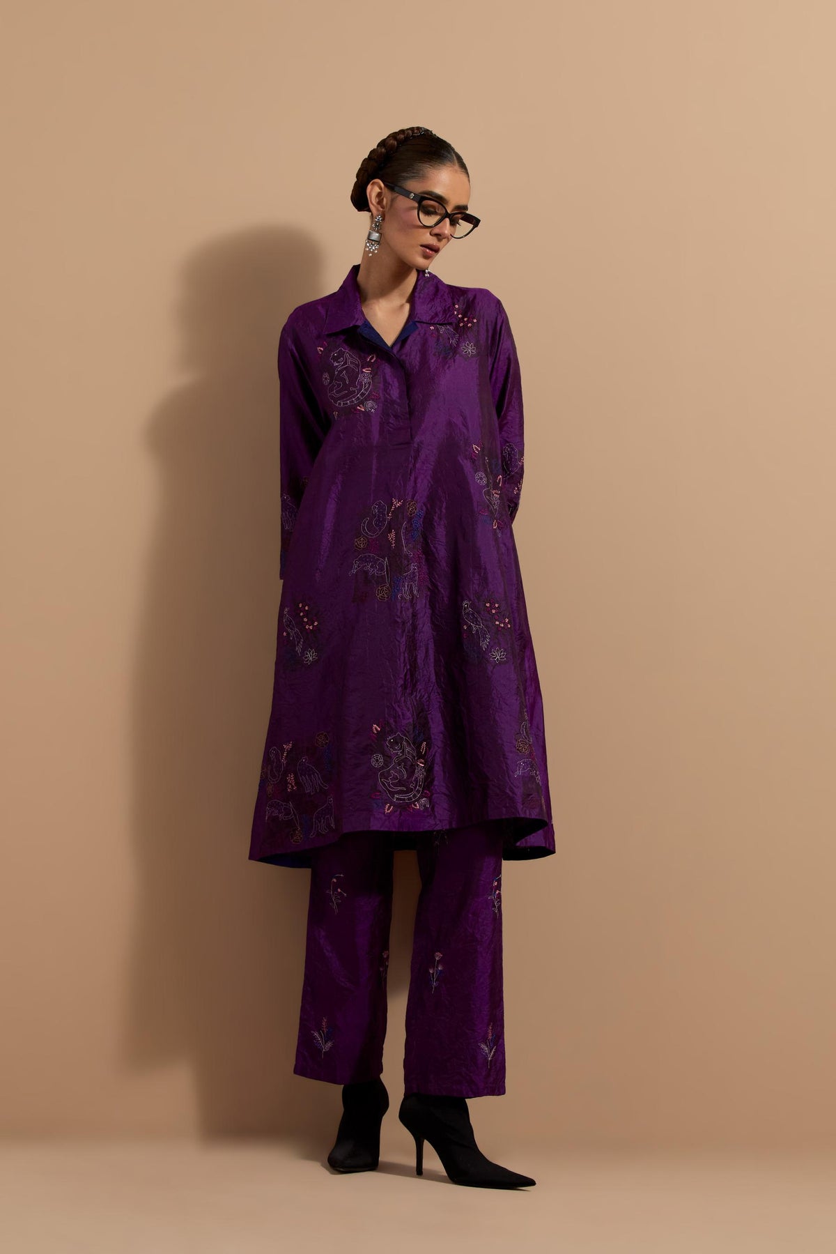 Purple crushed silk A-line short kurta set with hand block print, highlighted with multi colored thread embroidery.