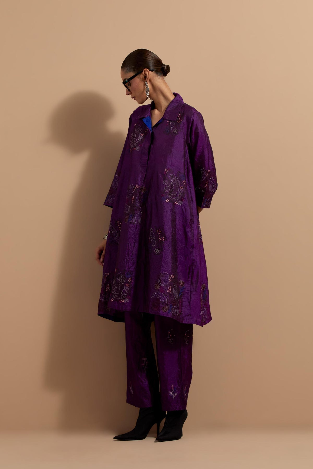Purple crushed silk A-line short kurta set with hand block print, highlighted with multi colored thread embroidery.