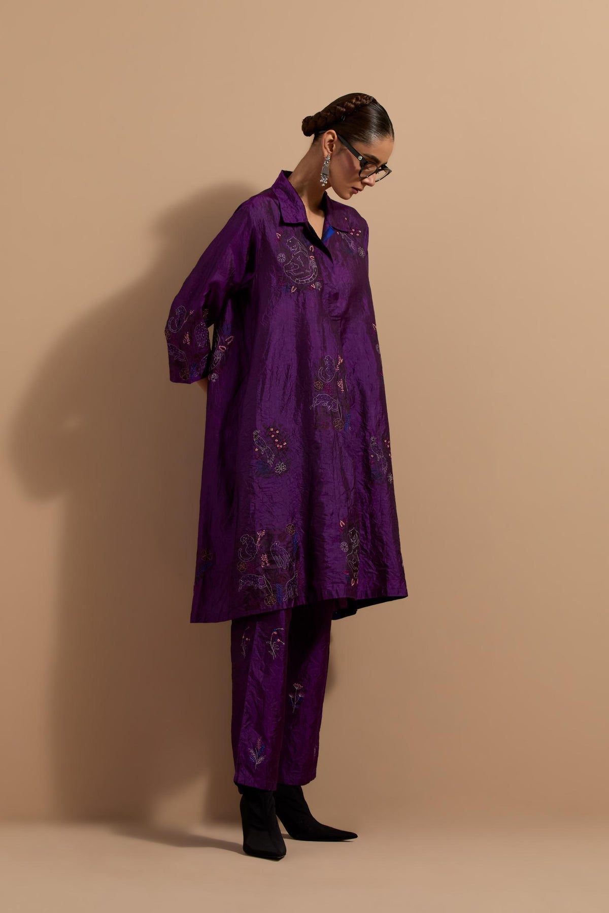 Purple crushed silk A-line short kurta set with hand block print, highlighted with multi colored thread embroidery.