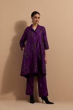 Purple crushed silk A-line short kurta set with hand block print, highlighted with multi colored thread embroidery.