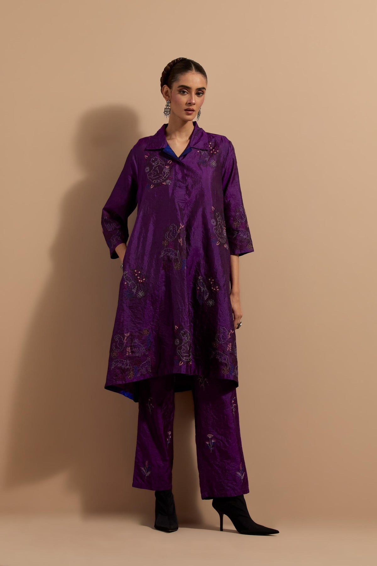 Purple crushed silk A-line short kurta set with hand block print, highlighted with multi colored thread embroidery.