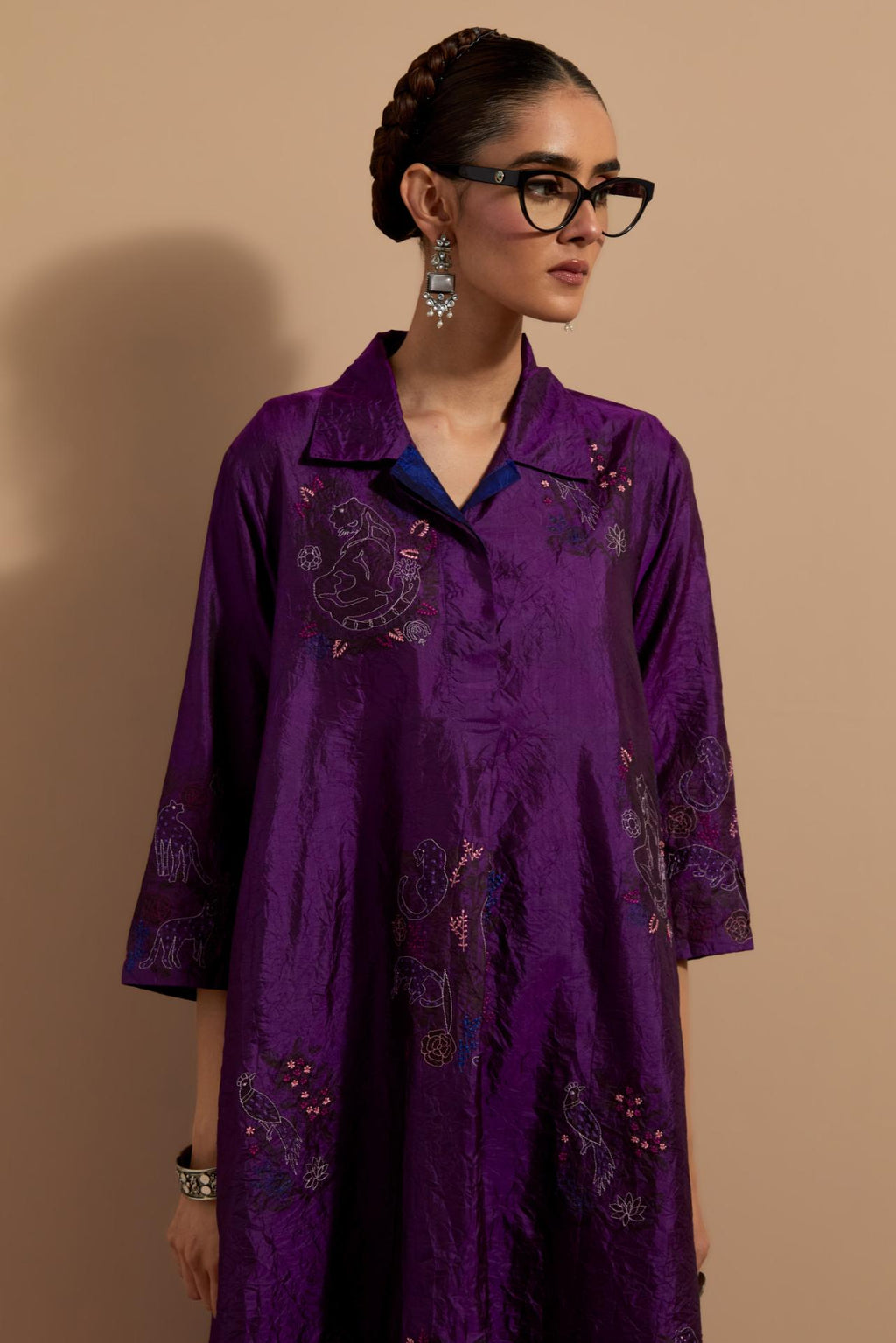 Purple crushed silk A-line short kurta set with hand block print, highlighted with multi colored thread embroidery.
