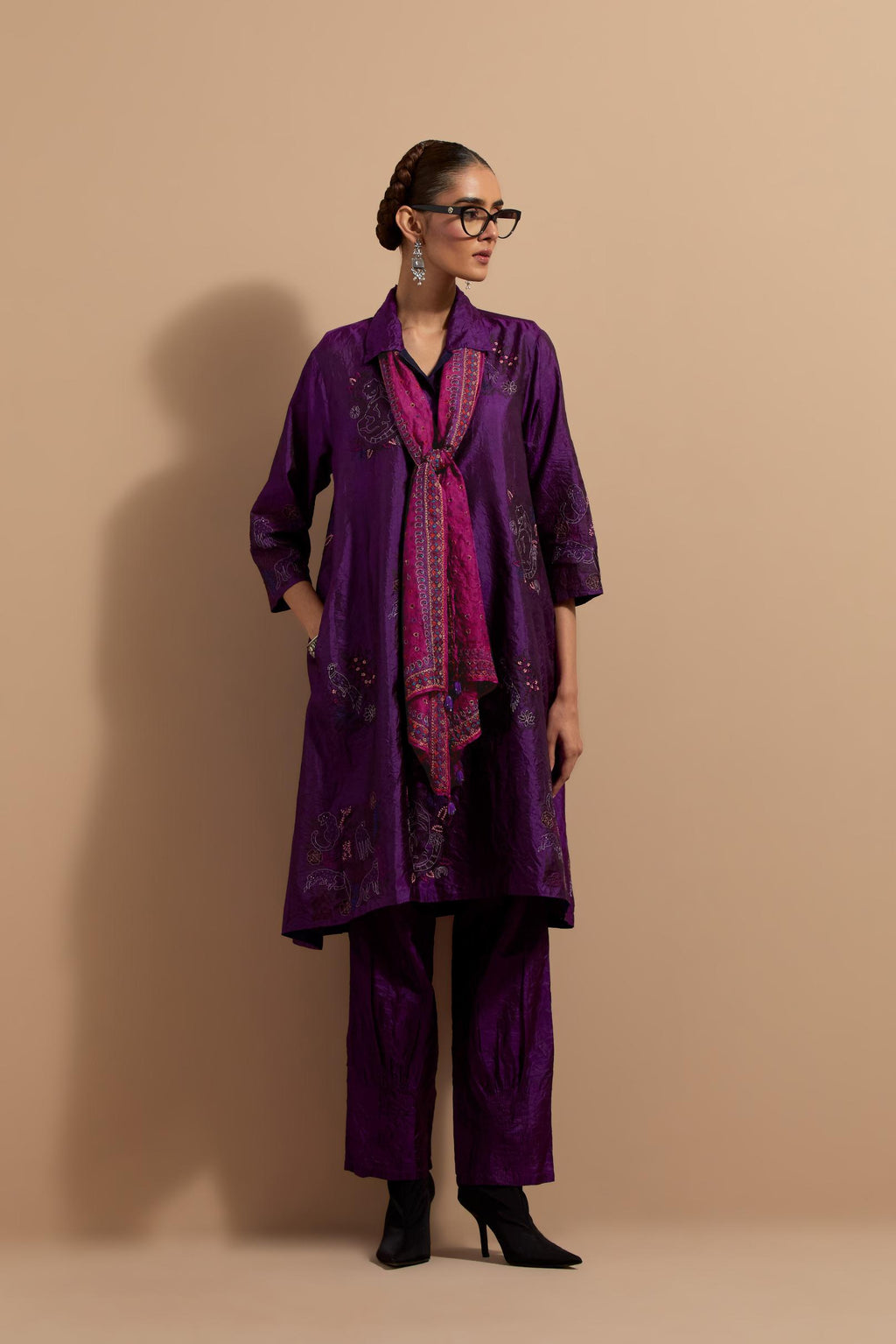 Purple crushed silk A-line short kurta set with hand block print, highlighted with multi colored thread embroidery.