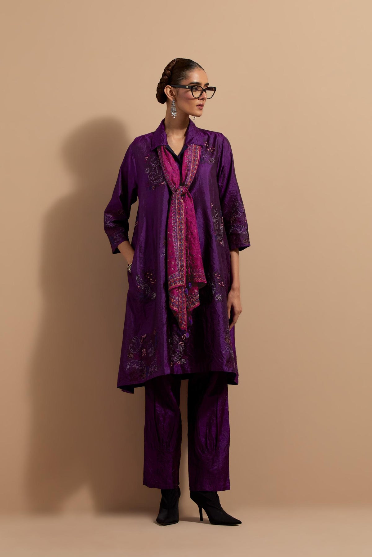 Purple crushed silk A-line short kurta set with hand block print, highlighted with multi colored thread embroidery.