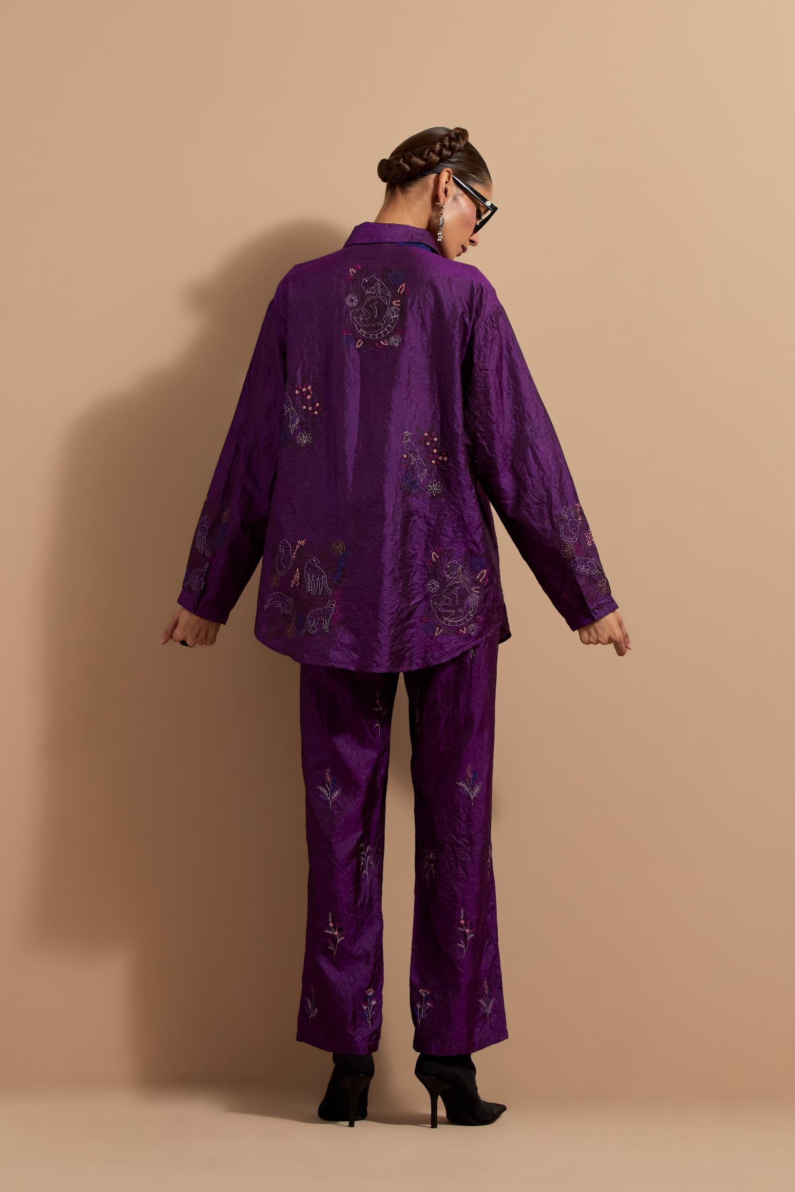 Purple crushed silk hand block printed shirt, highlighted with multi colored thread embroidery, paired with Purple crushed silk hand block printed pants, highlighted with multi colored thread embroidery.