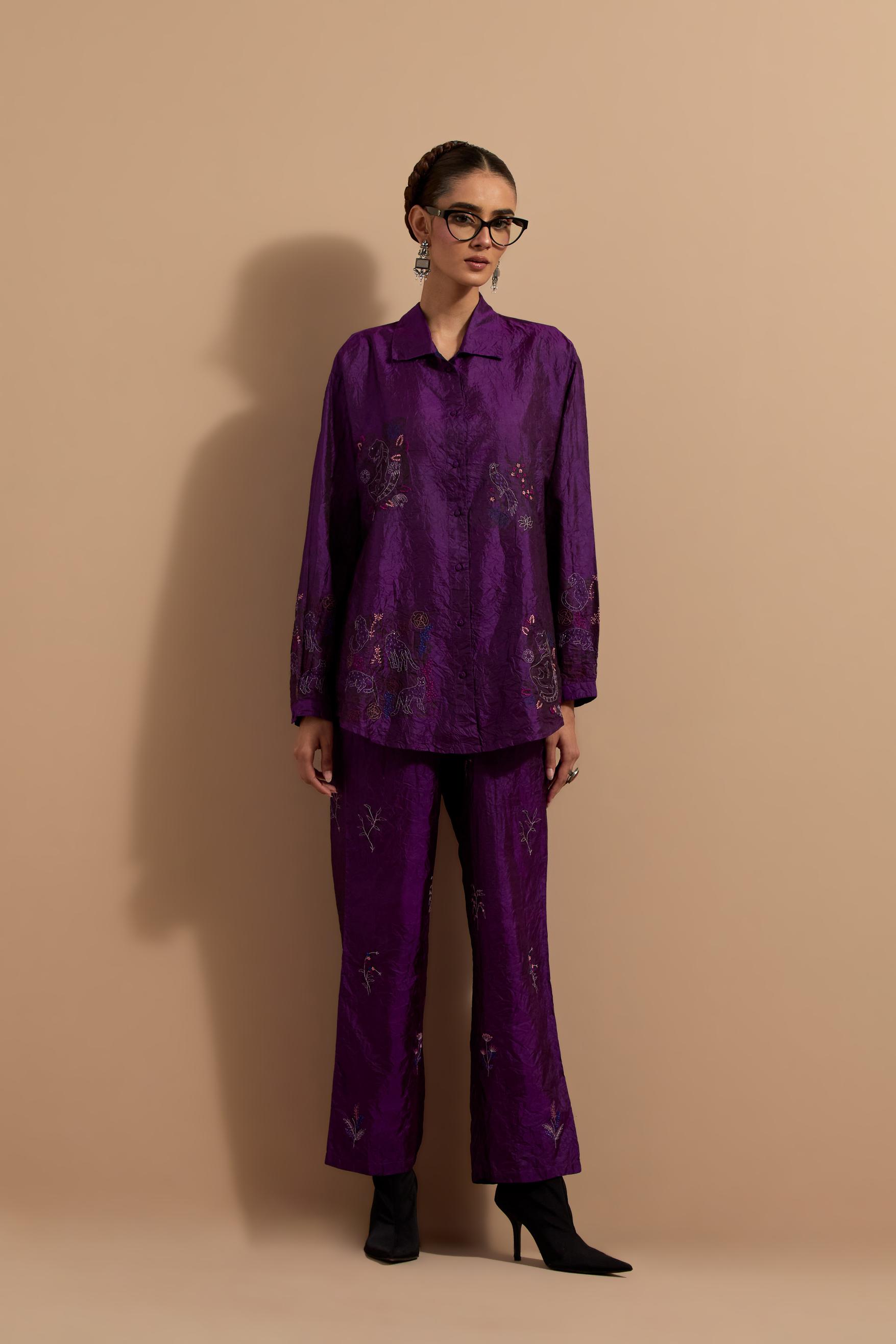 Purple crushed silk hand block printed shirt, highlighted with multi colored thread embroidery, paired with Purple crushed silk hand block printed pants, highlighted with multi colored thread embroidery.