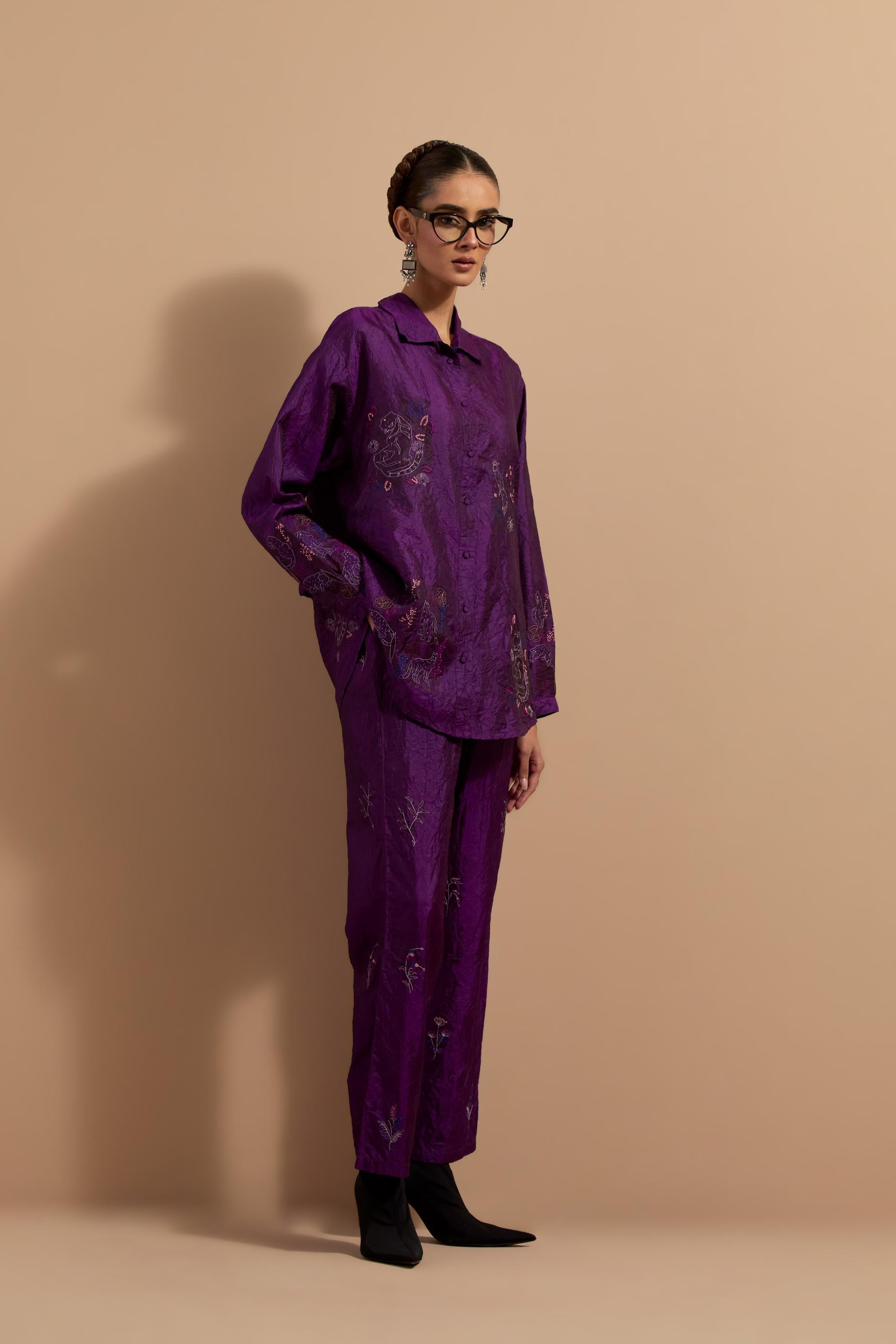 Purple crushed silk hand block printed shirt, highlighted with multi colored thread embroidery, paired with Purple crushed silk hand block printed pants, highlighted with multi colored thread embroidery.