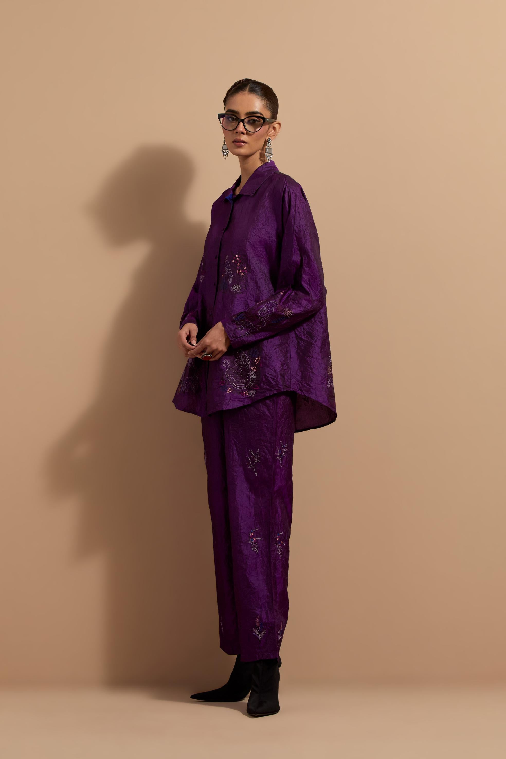 Purple crushed silk hand block printed shirt, highlighted with multi colored thread embroidery, paired with Purple crushed silk hand block printed pants, highlighted with multi colored thread embroidery.