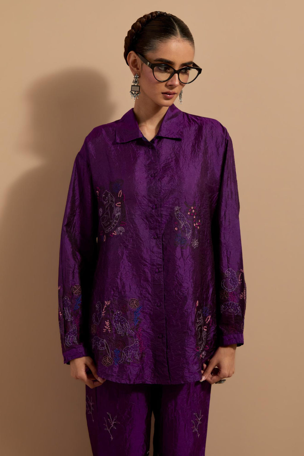 Purple crushed silk hand block printed shirt, highlighted with multi colored thread embroidery, paired with Purple crushed silk hand block printed pants, highlighted with multi colored thread embroidery.