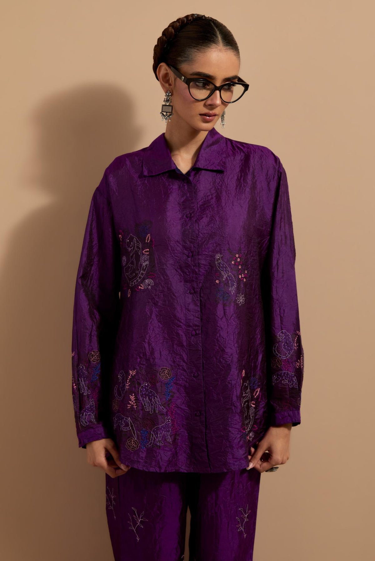 Purple crushed silk hand block printed shirt, highlighted with multi colored thread embroidery, paired with Purple crushed silk hand block printed pants, highlighted with multi colored thread embroidery.