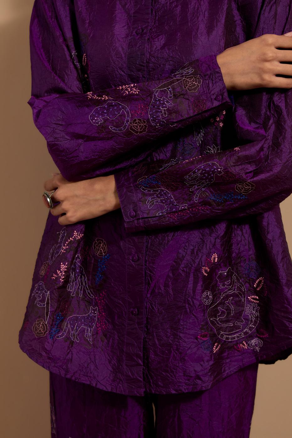 Purple crushed silk hand block printed shirt, highlighted with multi colored thread embroidery, paired with Purple crushed silk hand block printed pants, highlighted with multi colored thread embroidery.