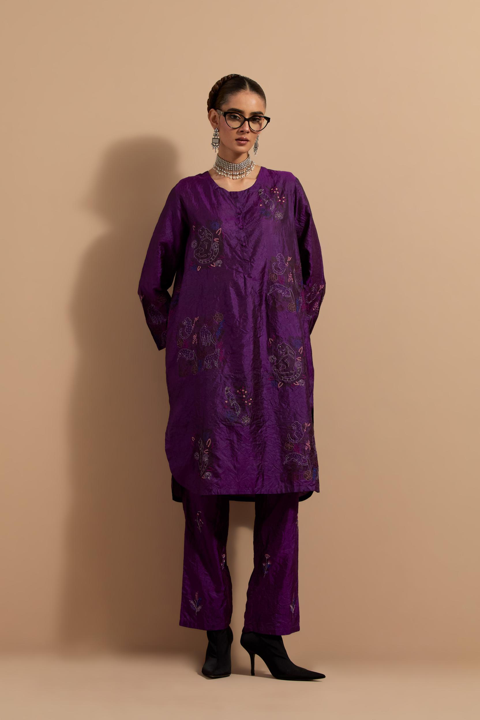 Purple crushed silk short kurta set with hand block print, highlighted with multi colored thread embroidery.