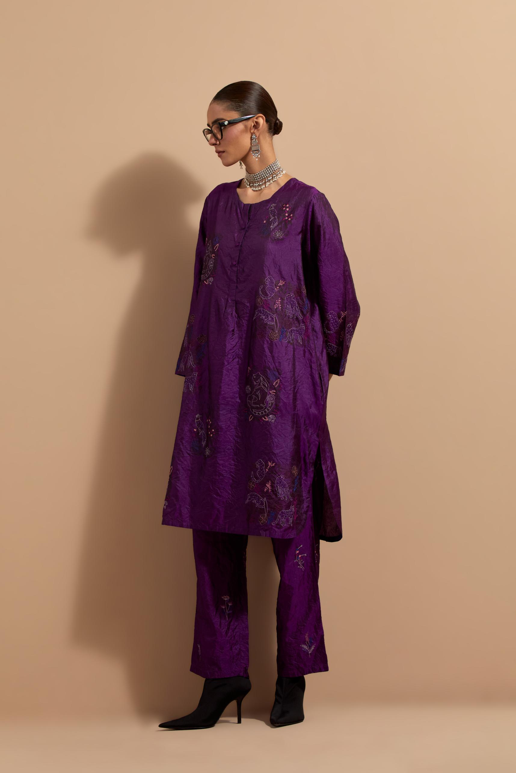 Purple crushed silk short kurta set with hand block print, highlighted with multi colored thread embroidery.
