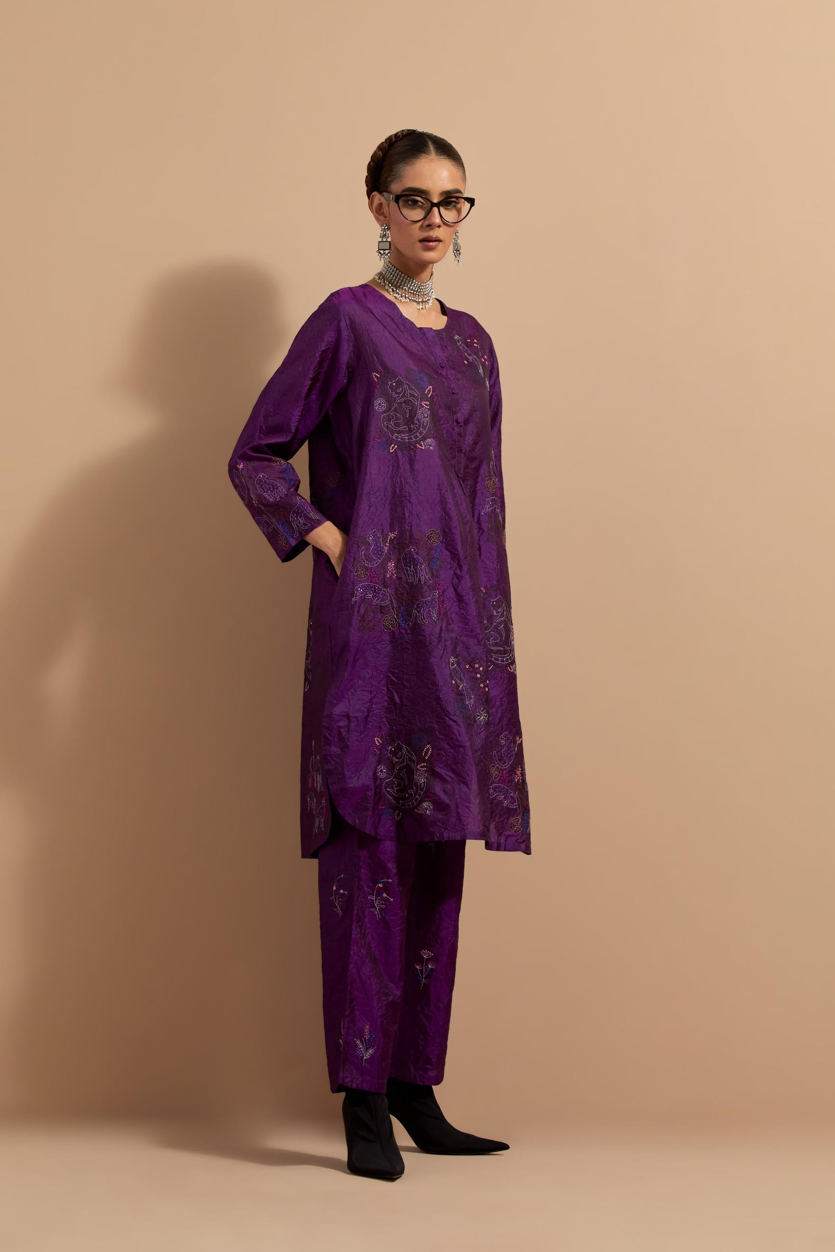 Purple crushed silk short kurta set with hand block print, highlighted with multi colored thread embroidery.