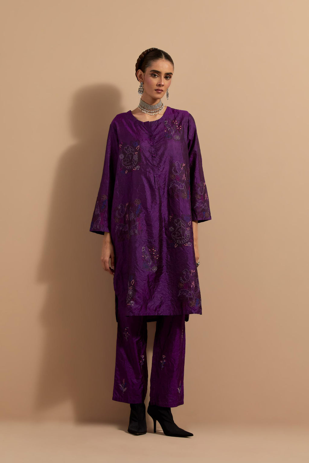 Purple crushed silk short kurta set with hand block print, highlighted with multi colored thread embroidery.