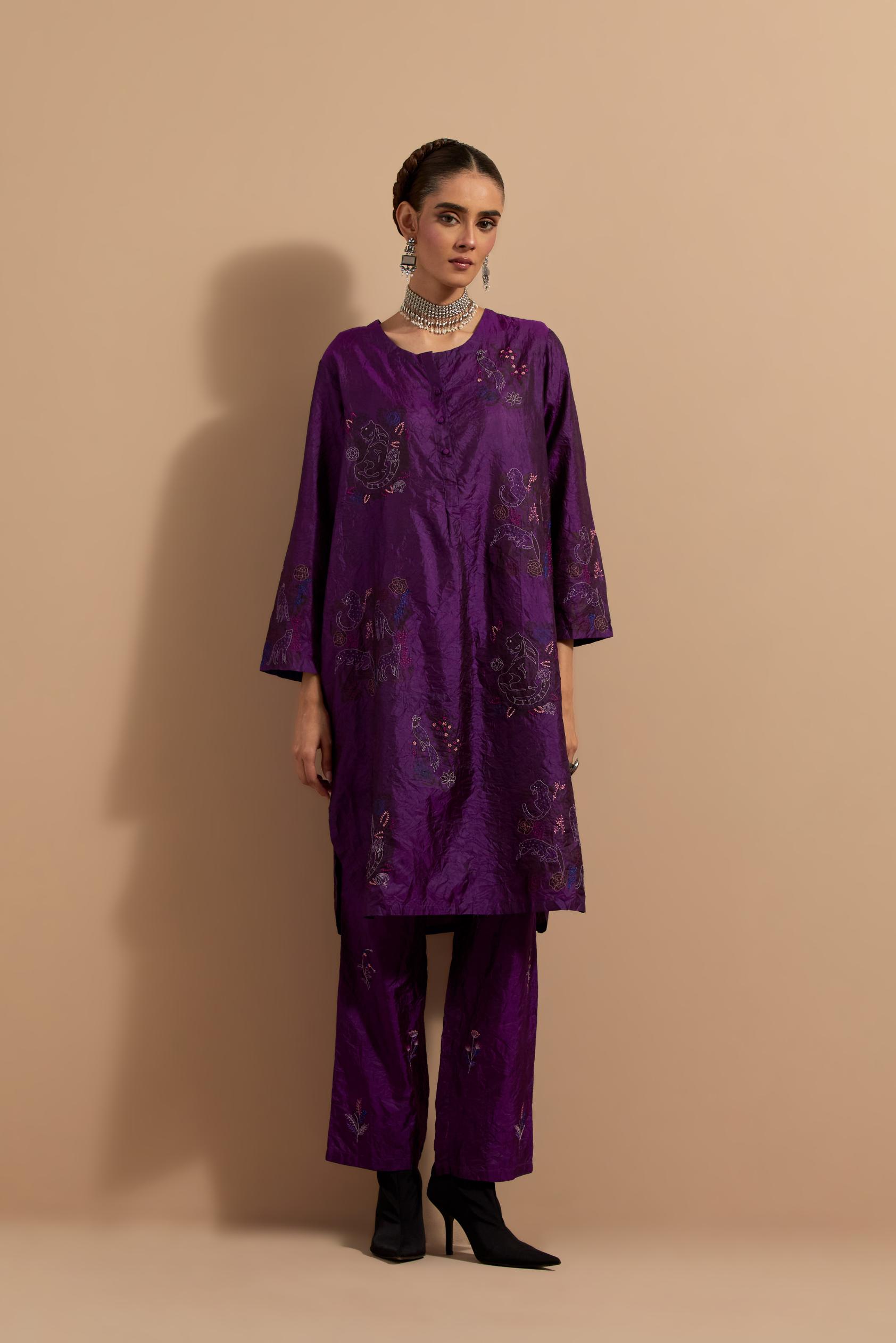 Purple crushed silk short kurta set with hand block print, highlighted with multi colored thread embroidery.