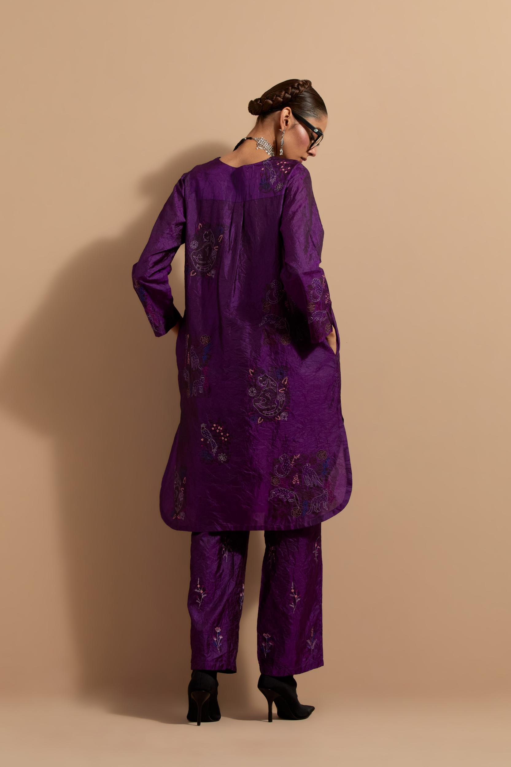Purple crushed silk short kurta set with hand block print, highlighted with multi colored thread embroidery.