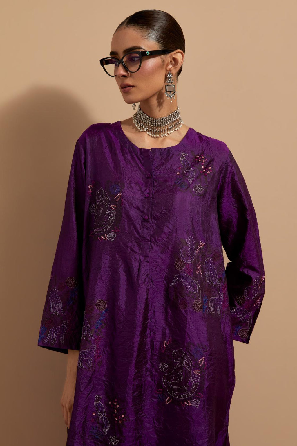 Purple crushed silk short kurta set with hand block print, highlighted with multi colored thread embroidery.