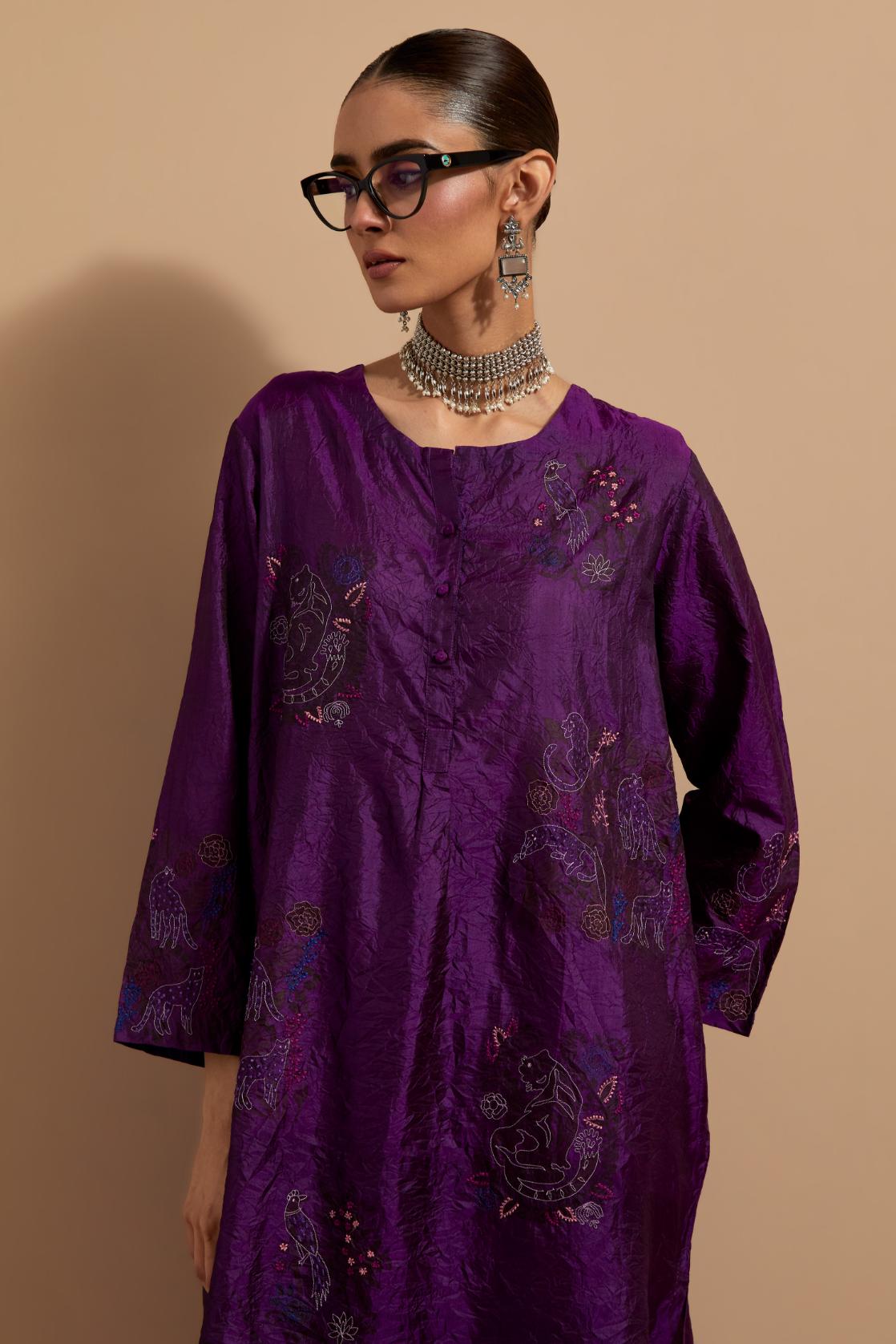Purple crushed silk short kurta set with hand block print, highlighted with multi colored thread embroidery.
