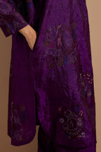 Purple crushed silk short kurta set with hand block print, highlighted with multi colored thread embroidery.