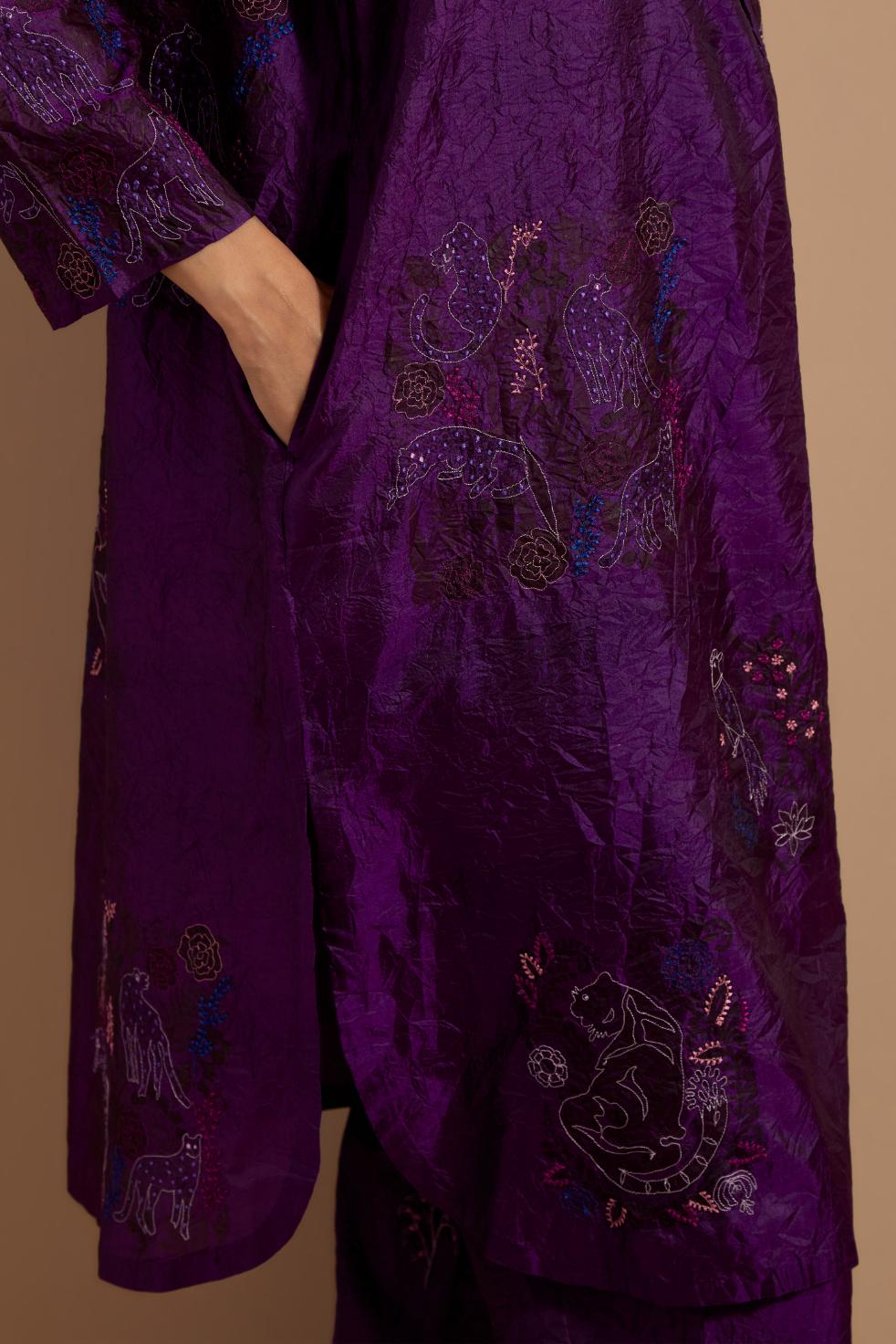 Purple crushed silk short kurta set with hand block print, highlighted with multi colored thread embroidery.