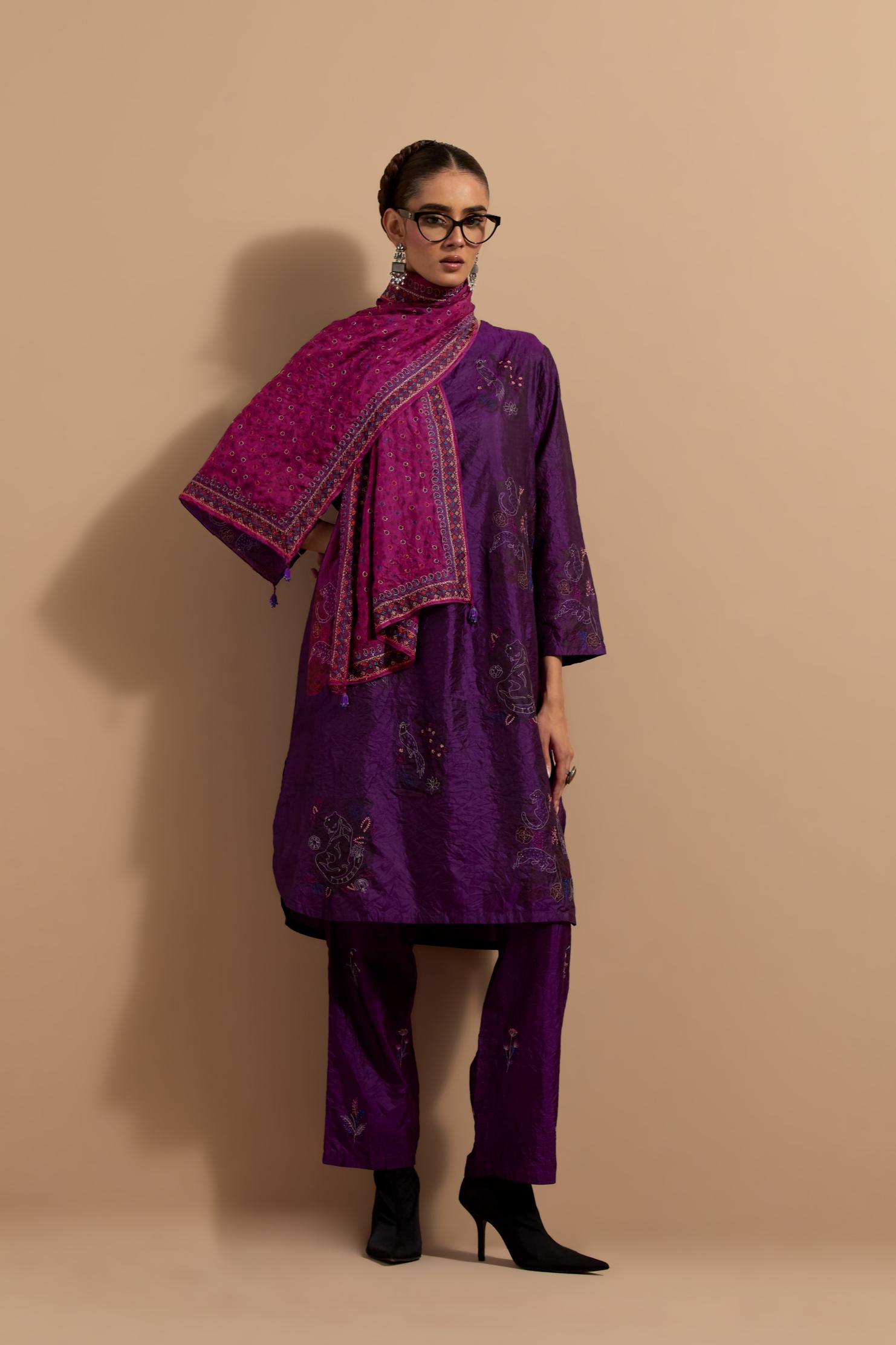 Purple crushed silk short kurta set with hand block print, highlighted with multi colored thread embroidery.