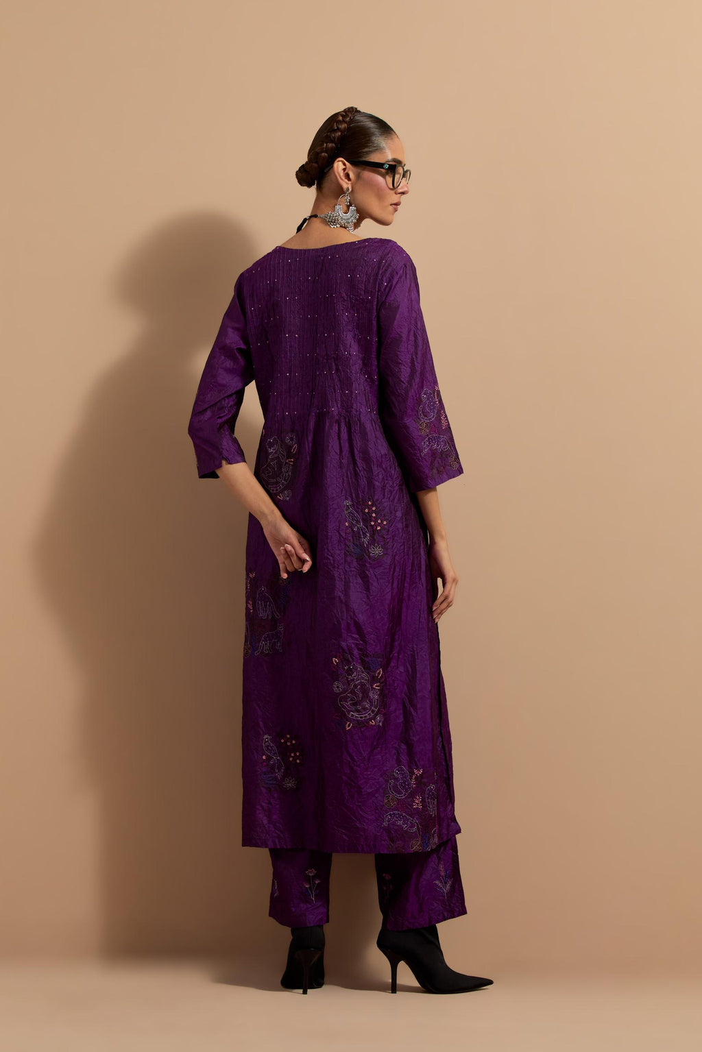 Purple crushed silk hand block printed kurta set with pin tucks at yoke, highlighted with multi colored thread embroidery.