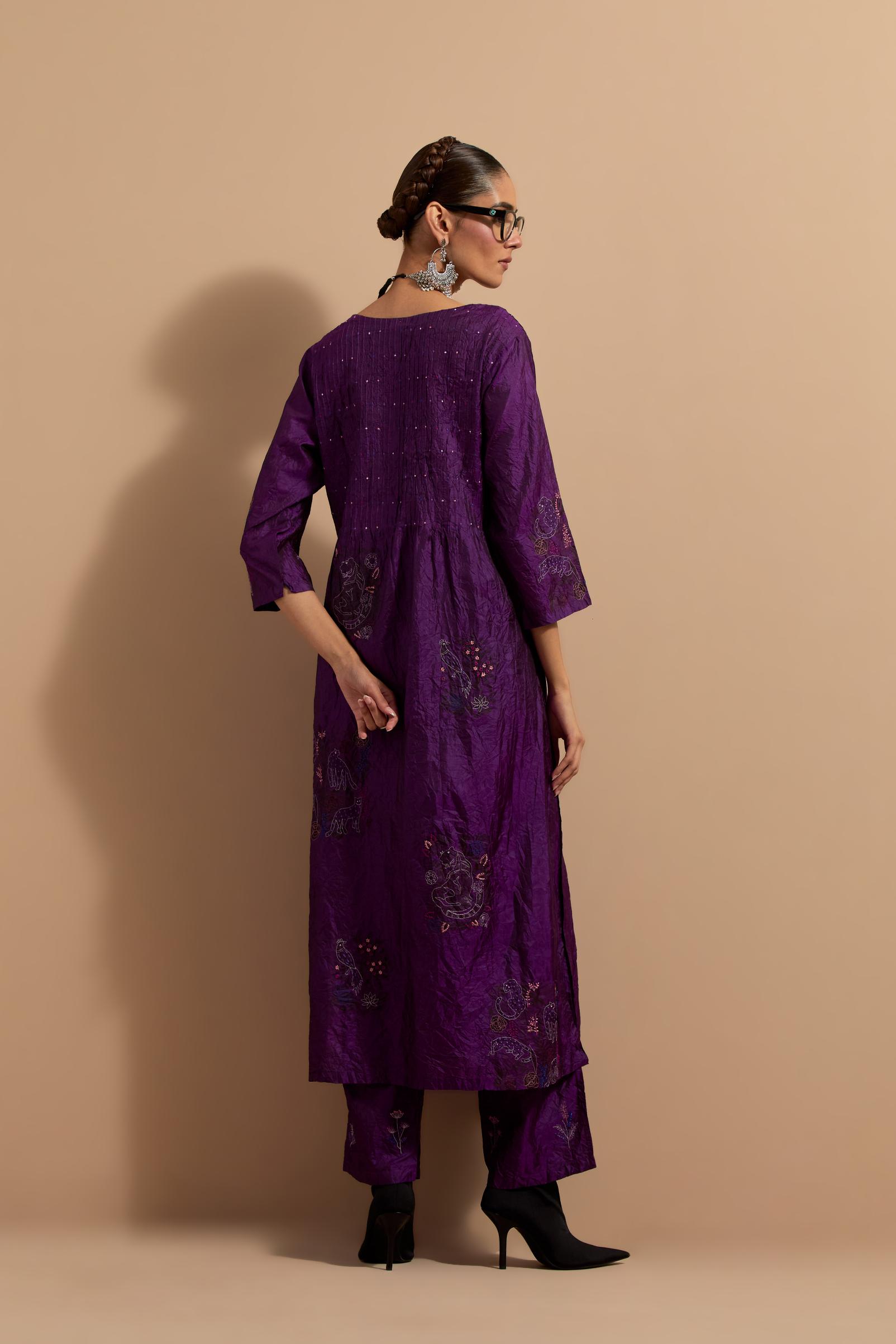 Purple crushed silk hand block printed kurta set with pin tucks at yoke, highlighted with multi colored thread embroidery.