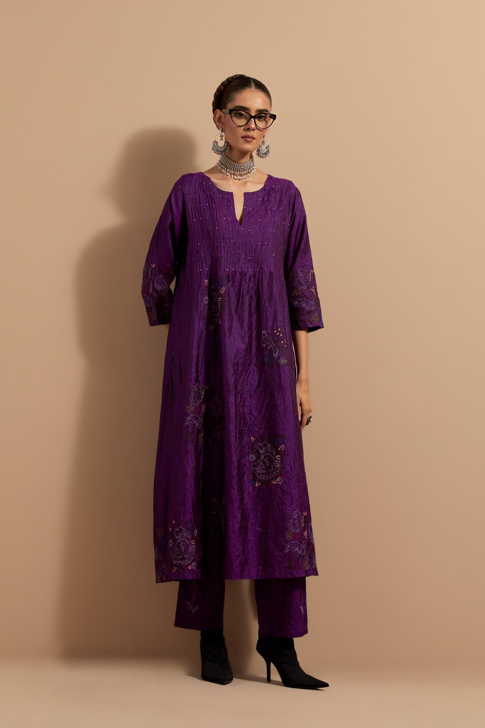 Purple crushed silk hand block printed kurta set with pin tucks at yoke, highlighted with multi colored thread embroidery.