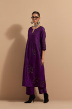 Purple crushed silk hand block printed kurta set with pin tucks at yoke, highlighted with multi colored thread embroidery.