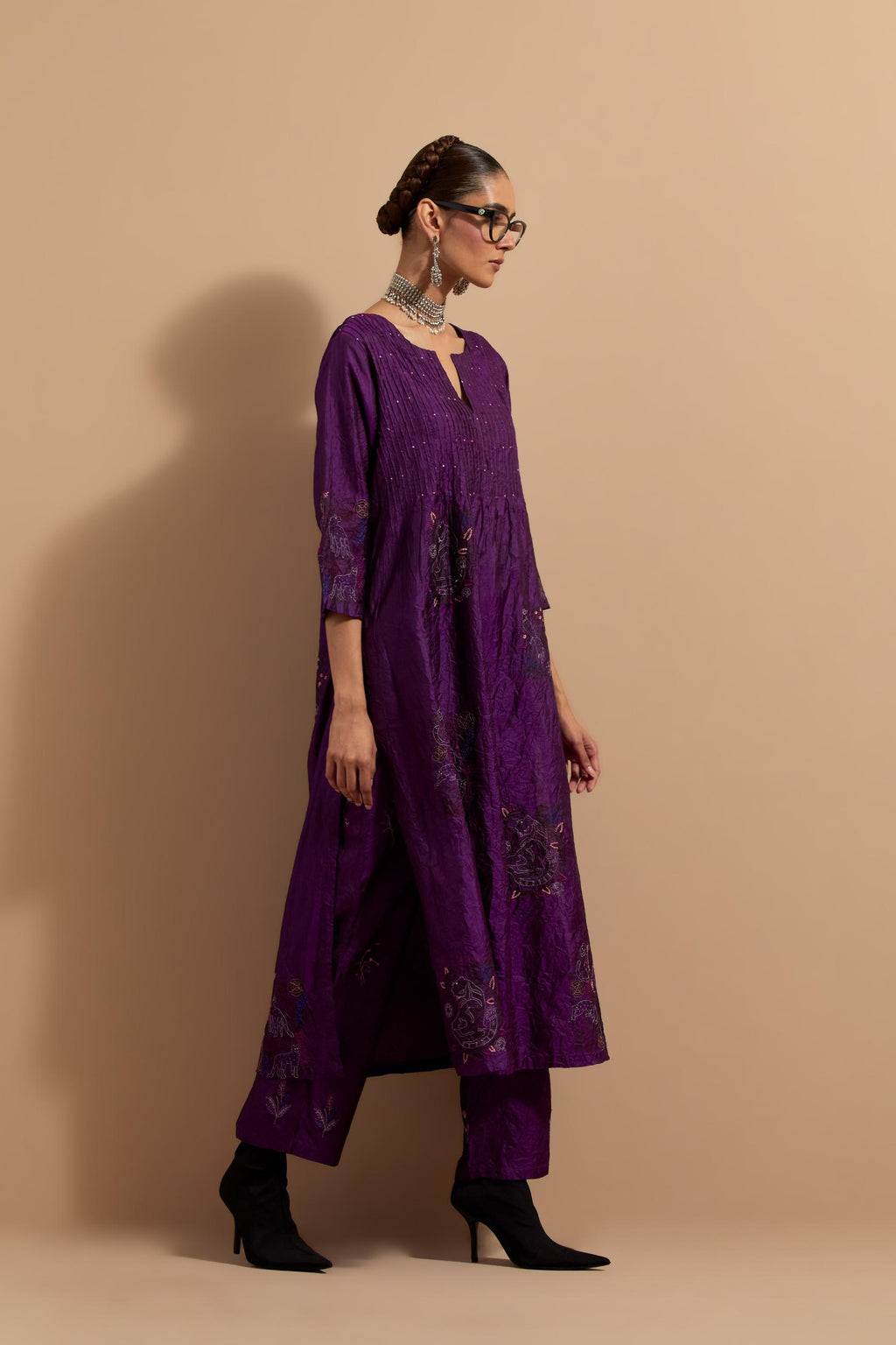 Purple crushed silk hand block printed kurta set with pin tucks at yoke, highlighted with multi colored thread embroidery.