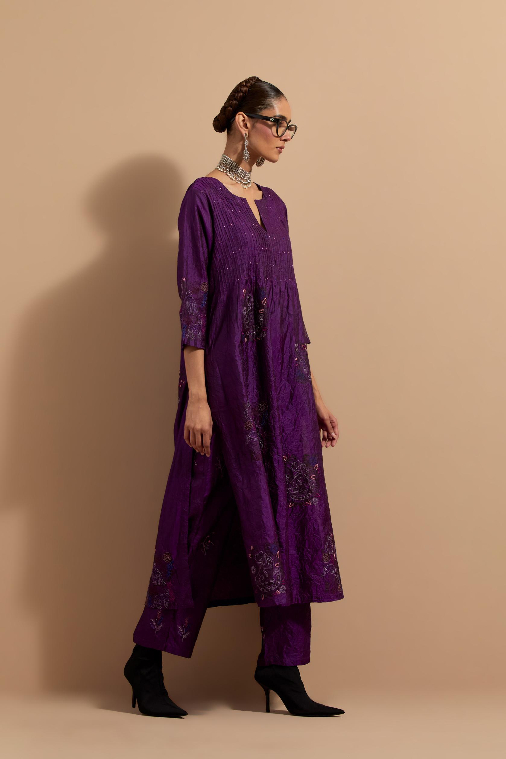 Purple crushed silk hand block printed kurta set with pin tucks at yoke, highlighted with multi colored thread embroidery.