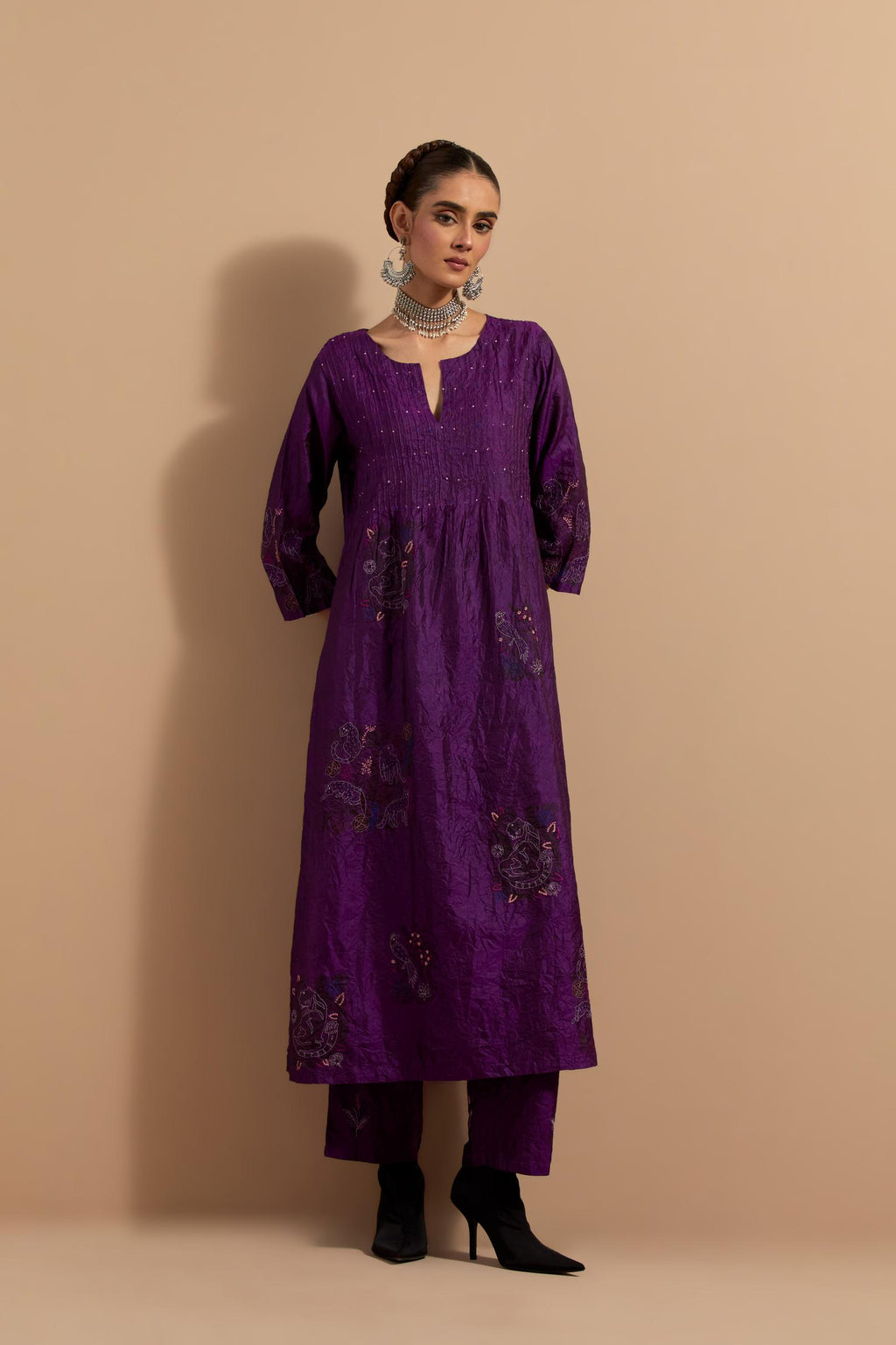 Purple crushed silk hand block printed kurta set with pin tucks at yoke, highlighted with multi colored thread embroidery.