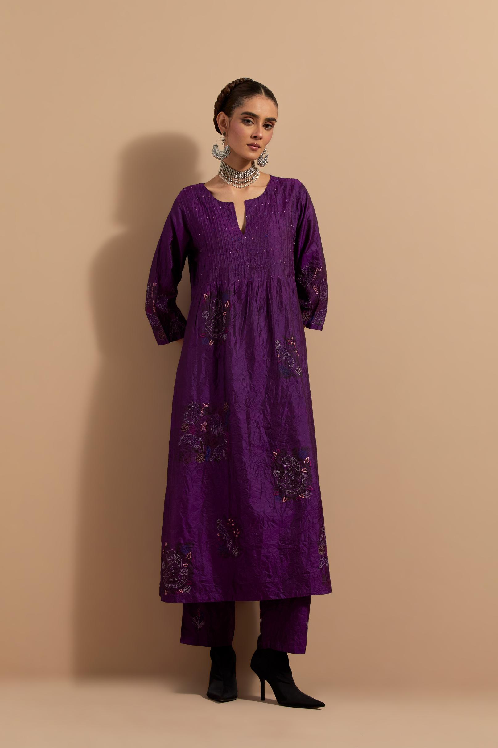 Purple crushed silk hand block printed kurta set with pin tucks at yoke, highlighted with multi colored thread embroidery.